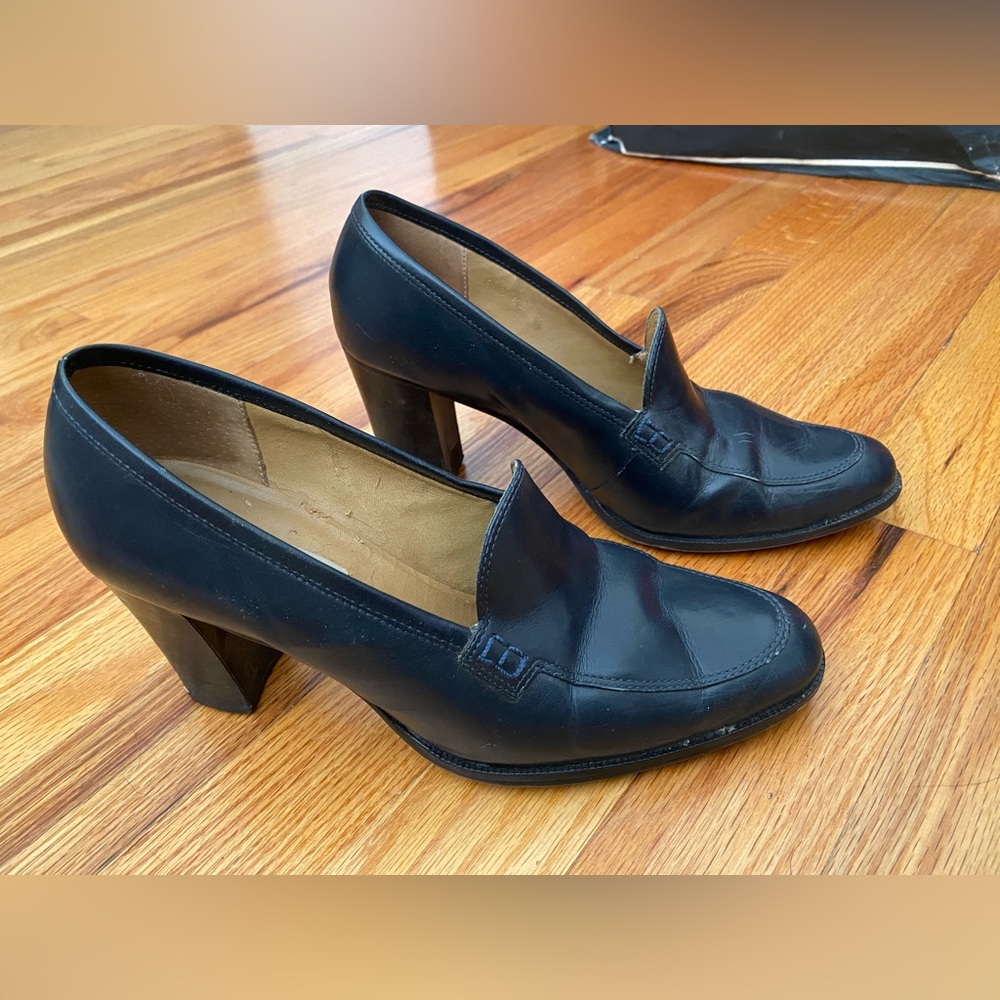 Navy leather heeled loafers.
